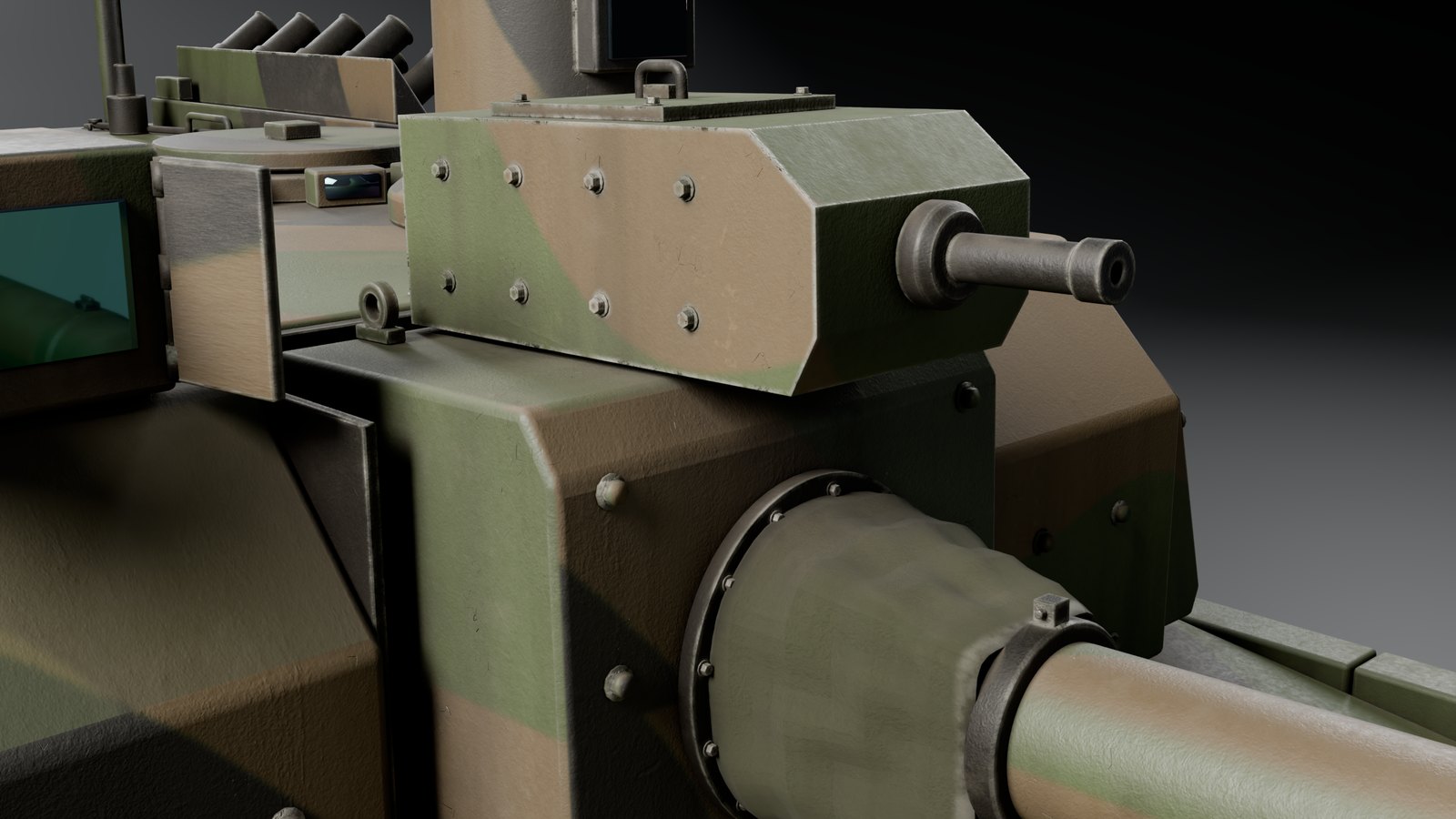 Gros plan du mantelet : caisson de la mitrailleuse coaxiale et housse du canon